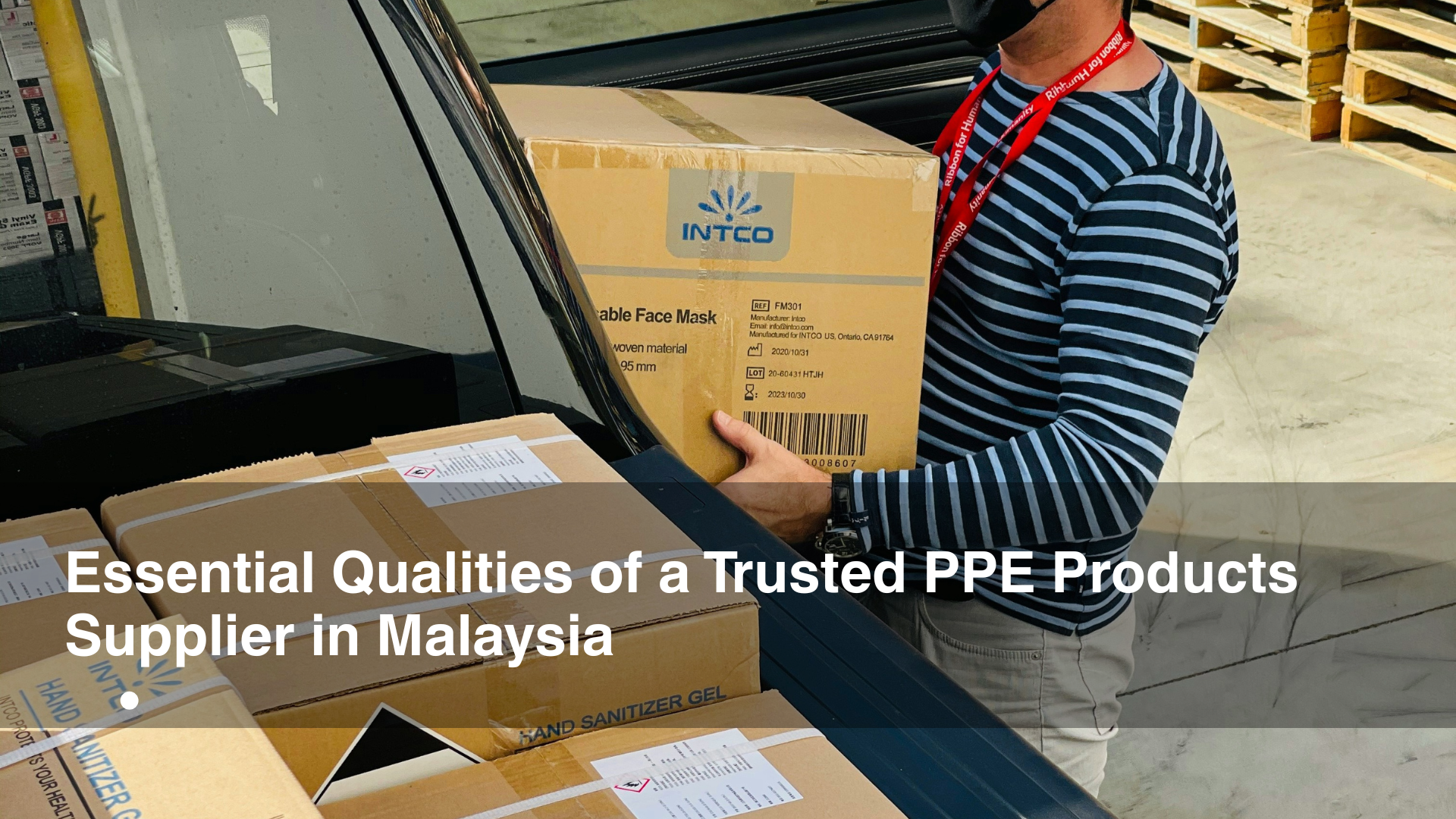 Man loading PPE supplies into back of truck